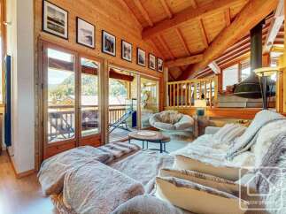 Experience the epitome of alpine luxury in this stunning property, boasting exquisite wooden interiors and breathtaking mountain views.