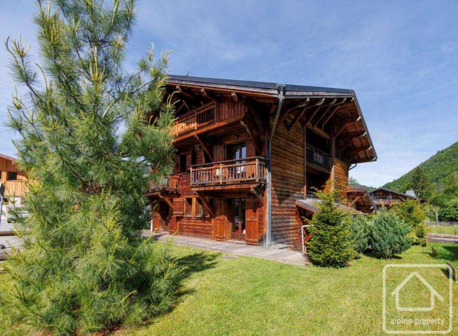 Discover the charm of this stunning wooden chalet nestled in a picturesque setting.