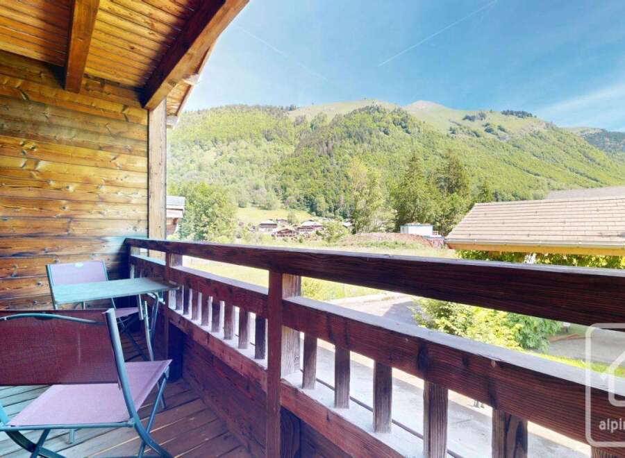Enjoy breathtaking mountain views from this charming balcony.