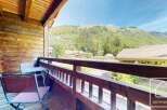 Enjoy breathtaking mountain views from this charming balcony.