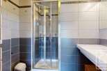 Step into a modern bathroom featuring a sleek glass shower enclosure.