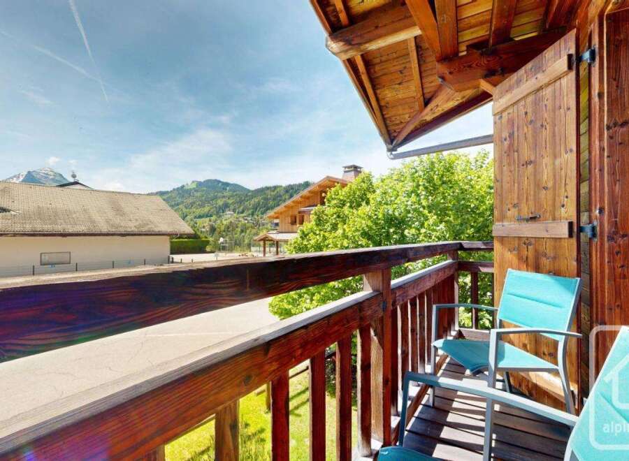 Enjoy breathtaking mountain views from this charming balcony.