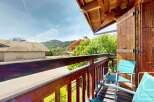 Enjoy breathtaking mountain views from this charming balcony.