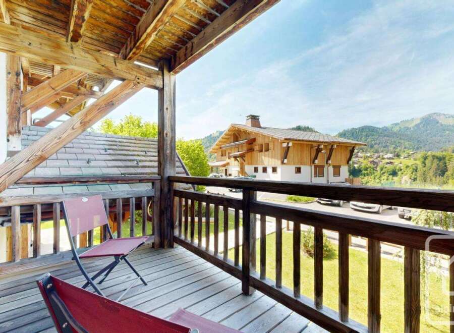 Enjoy breathtaking mountain views from this charming balcony.