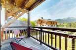 Enjoy breathtaking mountain views from this charming balcony.