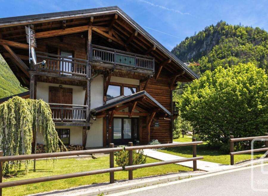 Discover the charm of this stunning wooden chalet nestled in a picturesque mountain setting.