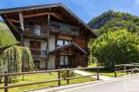 Discover the charm of this stunning wooden chalet nestled in a picturesque mountain setting.