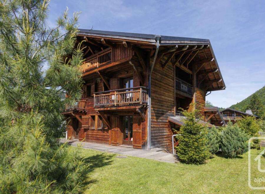Discover the charm of this stunning wooden chalet, nestled in a picturesque mountain setting.
