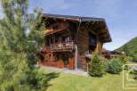 Discover the charm of this stunning wooden chalet, nestled in a picturesque mountain setting.