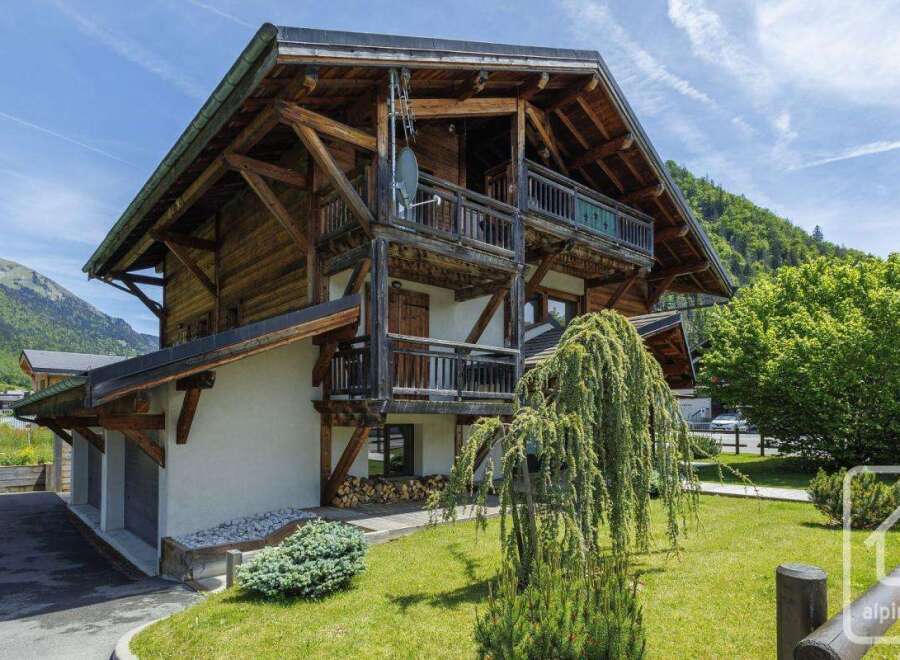 Discover the charm of this stunning wooden chalet nestled in a picturesque mountain setting.