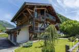 Discover the charm of this stunning wooden chalet nestled in a picturesque mountain setting.