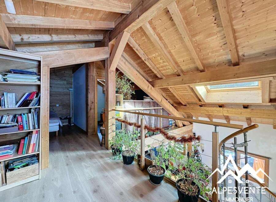 Discover the charm of this stunning property, featuring a beautifully crafted wooden interior and a unique architectural design.