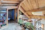 Discover the charm of this stunning property, featuring a beautifully crafted wooden interior and a unique architectural design.