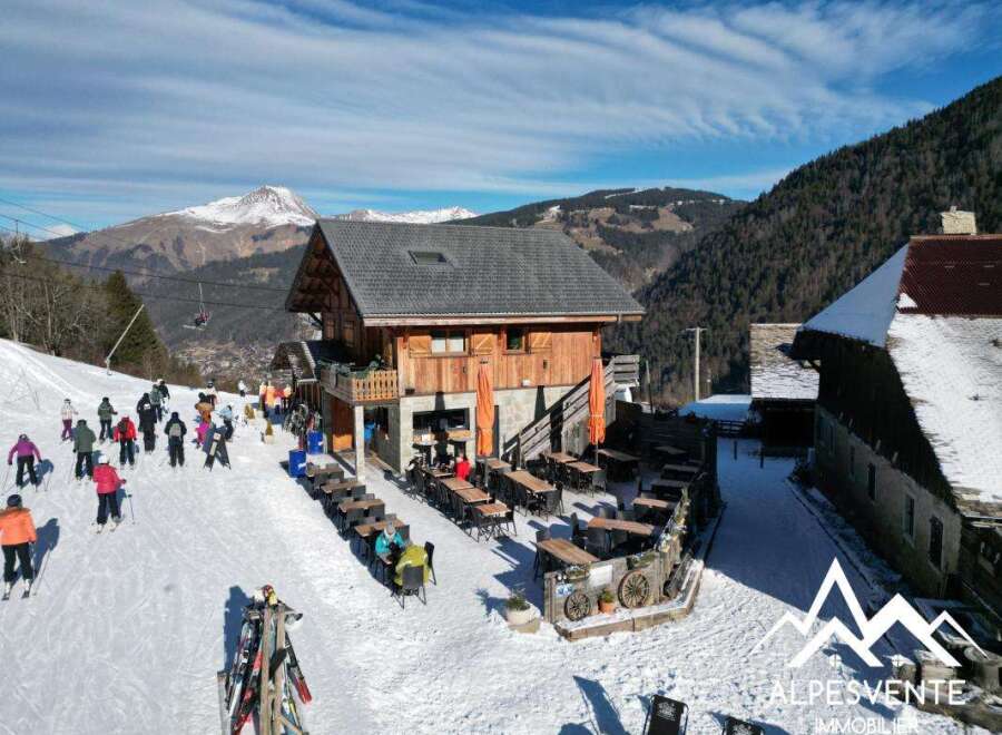Discover a charming ski chalet nestled in the heart of the mountains, offering stunning views and a cozy atmosphere.