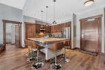 This stunning kitchen boasts a modern design with sleek wooden cabinetry and a spacious island, perfect for entertaining.