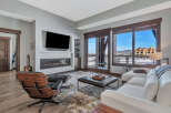 Experience luxury living in this stunning property, featuring a modern fireplace and a sleek, contemporary design.