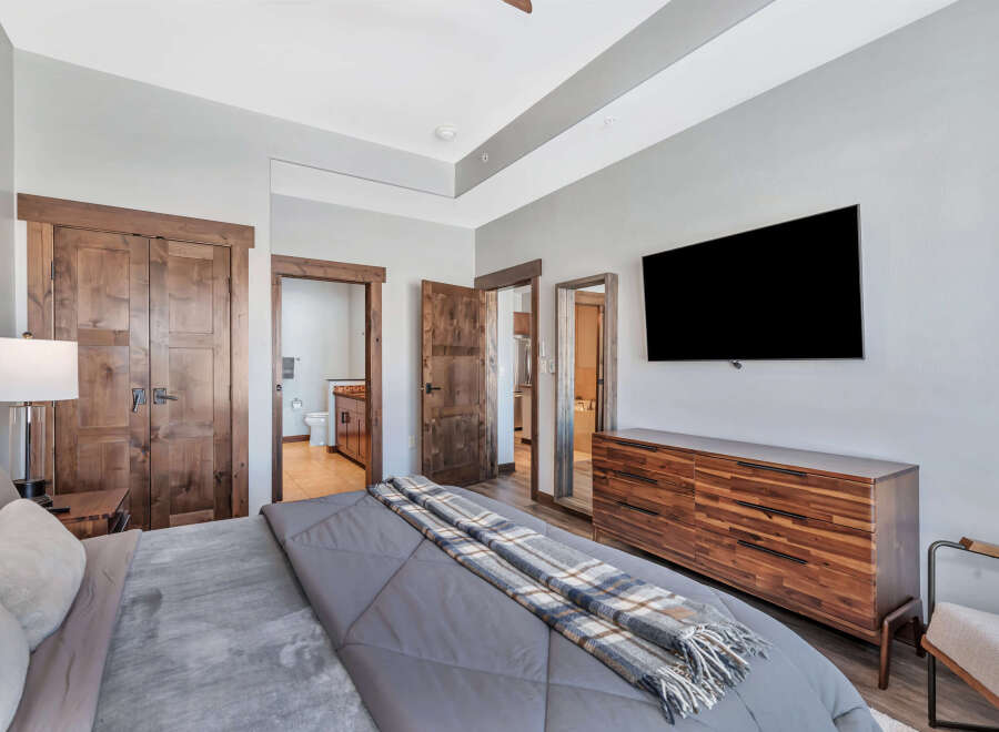 Step into luxury with this stunning bedroom featuring a modern design and high-end finishes.