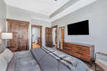 Step into luxury with this stunning bedroom featuring a modern design and high-end finishes.