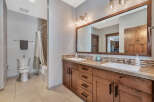 This stunning bathroom boasts a modern design with a touch of rustic charm.