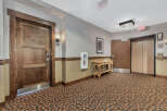 This inviting hallway showcases a blend of rustic charm and modern convenience.