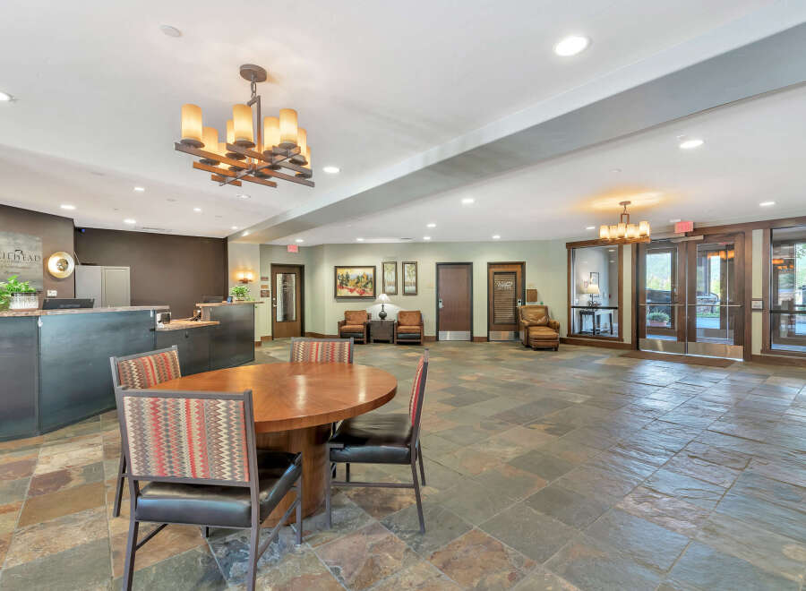 Step into the inviting Trailhead Lodge lobby, a welcoming space perfect for relaxation and socializing.