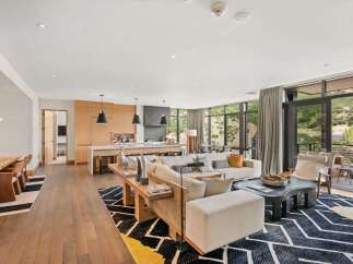 Experience luxury living in this stunning property, featuring an open-concept design that seamlessly blends the kitchen, living, and dining areas.