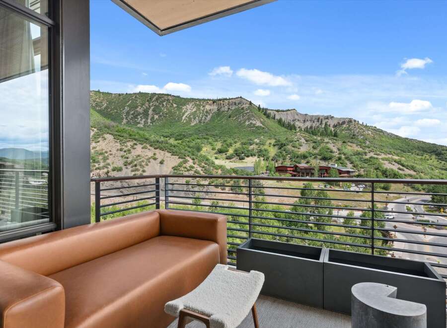 Enjoy breathtaking mountain views from this luxurious balcony.