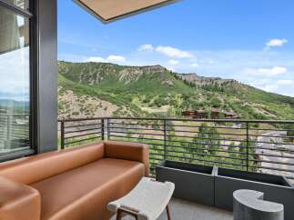 Enjoy breathtaking mountain views from this luxurious balcony.
