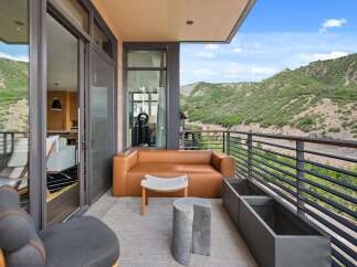 Enjoy breathtaking mountain views from this luxurious outdoor space.