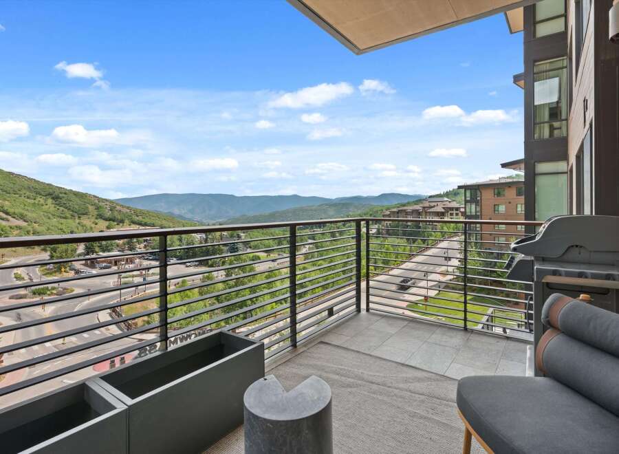 Enjoy breathtaking mountain views from this luxurious balcony.