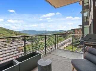Enjoy breathtaking mountain views from this luxurious balcony.