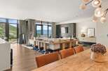Experience luxury living in this stunning property, featuring expansive windows that frame breathtaking mountain views.
