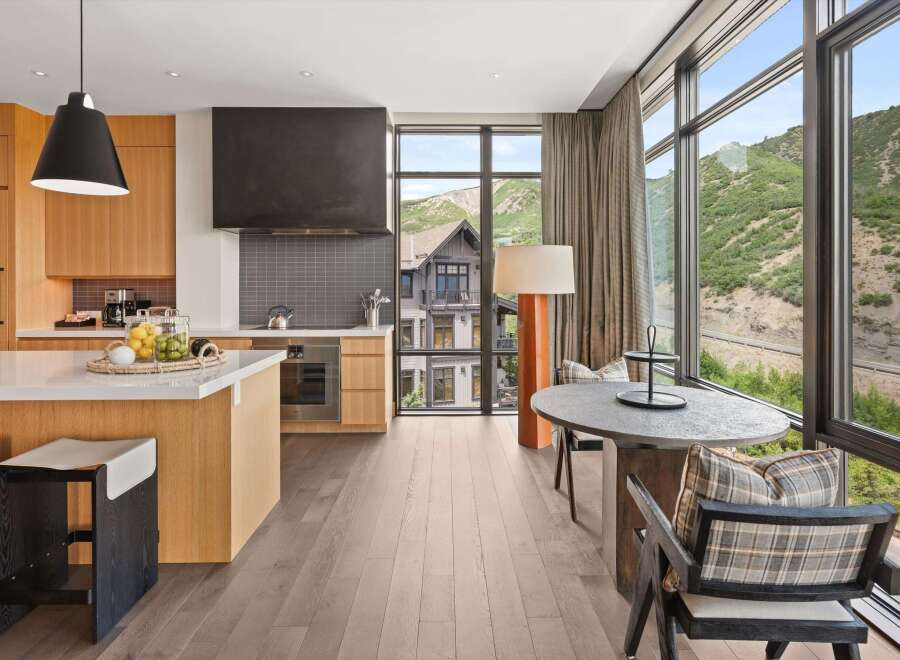 Experience luxury living in this stunning property, featuring a modern kitchen with sleek countertops and high-end appliances.