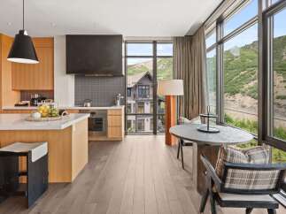 Experience luxury living in this stunning property, featuring a modern kitchen with sleek countertops and high-end appliances.