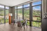 Experience breathtaking views from this luxurious property, featuring expansive windows that frame the stunning natural landscape.