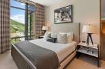 Experience luxury living in this stunning bedroom, featuring a spacious layout and elegant design.