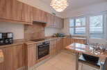 This stunning kitchen boasts modern appliances and ample counter space, perfect for culinary enthusiasts.