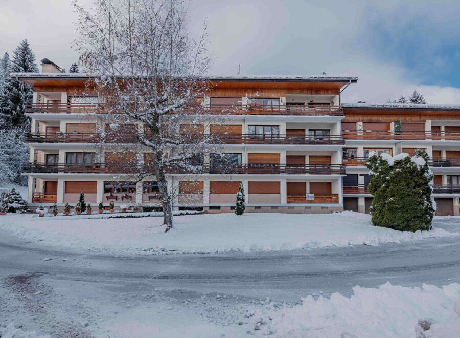 Discover a charming property nestled in a winter wonderland, offering a serene escape.