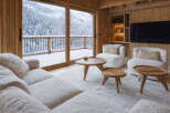 Experience the ultimate in luxury living with this stunning property, boasting breathtaking views of a snow-covered landscape.