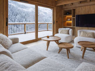 Experience the ultimate in luxury living with this stunning property, boasting breathtaking views of a snow-covered landscape.