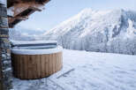Experience the ultimate winter escape with this stunning property featuring a luxurious hot tub.