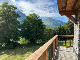 Experience breathtaking mountain views from this charming chalet's private balcony, perfect for enjoying your morning coffee or evening relaxation.