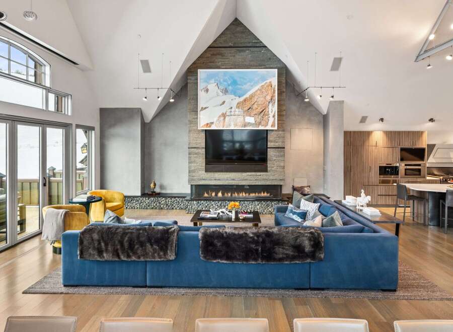Experience luxury living in this stunning property, featuring a modern design with high ceilings and expansive windows.