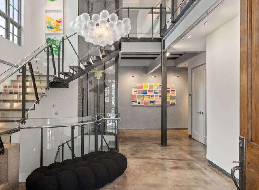 Step into luxury with this stunning modern home! Featuring a grand staircase, a unique bubble chandelier, and an open-concept design, this property is perfect for those who appreciate contemporary elegance.