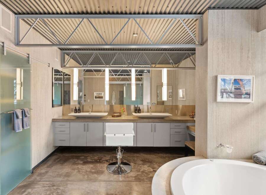 This stunning bathroom boasts a modern design with sleek lines and high-end finishes.