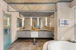 This stunning bathroom boasts a modern design with sleek lines and high-end finishes.
