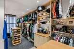 Step into luxury with this meticulously designed walk-in closet, a true haven for fashion enthusiasts.