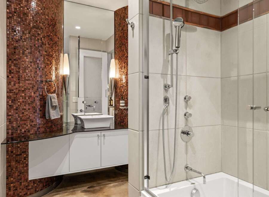 Step into luxury with this stunning bathroom featuring a modern design and high-end finishes.