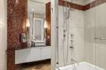 Step into luxury with this stunning bathroom featuring a modern design and high-end finishes.
