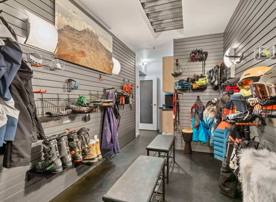 This stylish mudroom offers a practical and organized space for storing outdoor gear.
